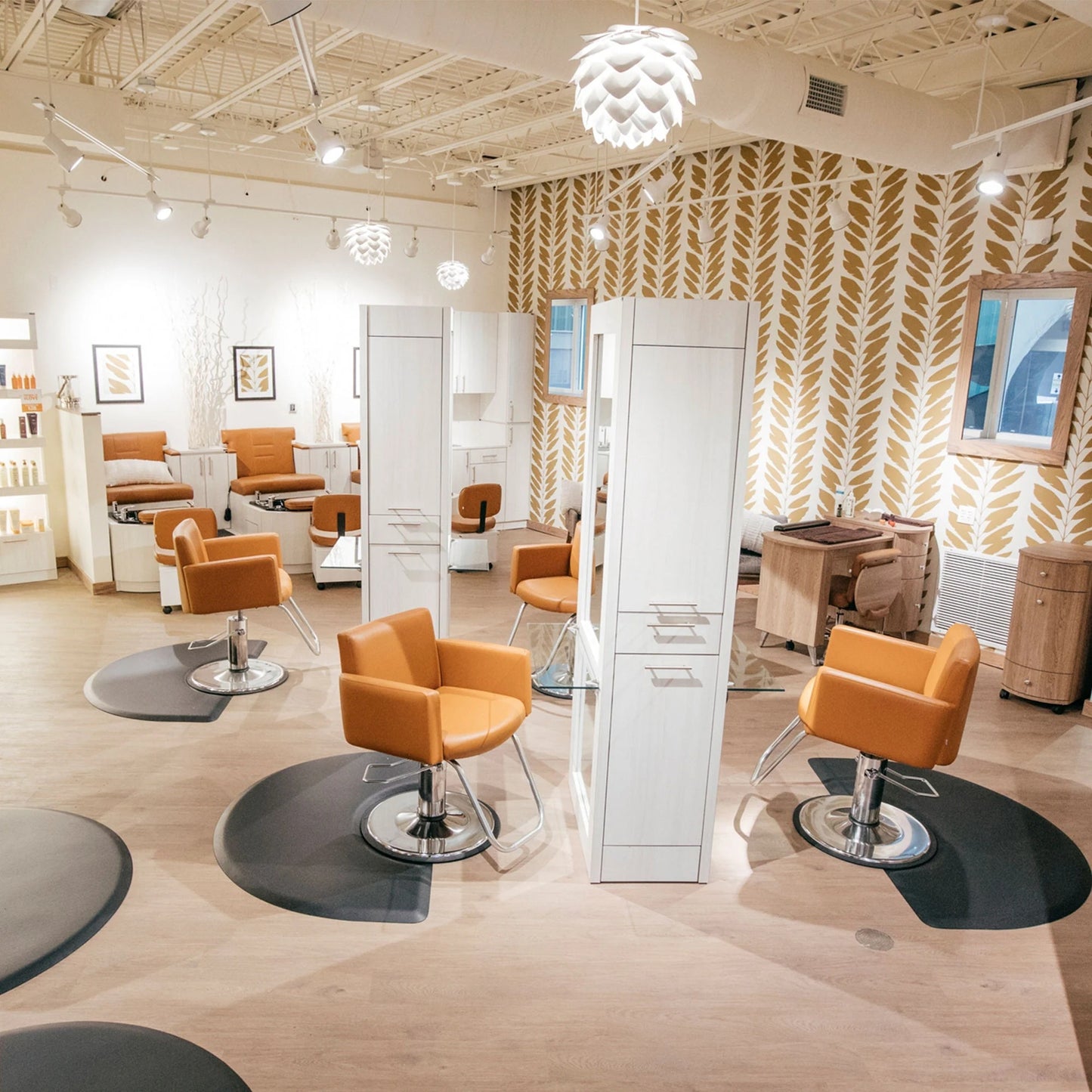 Collins Rio Formula Styling Island featuring a central island design with multiple mirrors, work surfaces, and storage for salon use.