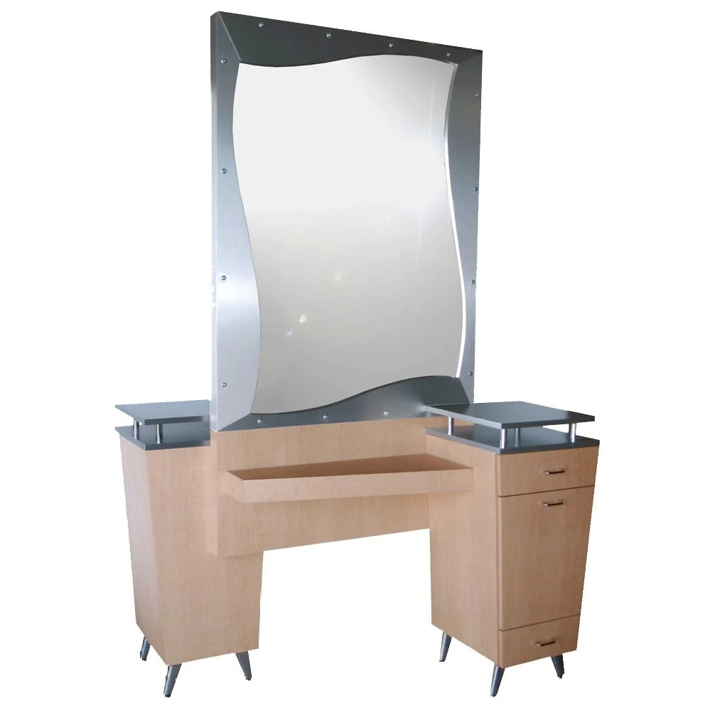 A sleek, Art Deco-inspired styling island with a wave-shaped mirror, designed for two back-to-back stylists. It includes an elevated work surface, cabinets, drawers, and cast aluminum legs.
