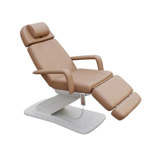Brown adjustable medical treatment chair with padded headrest, armrests, and segmented leg support on an electric base.