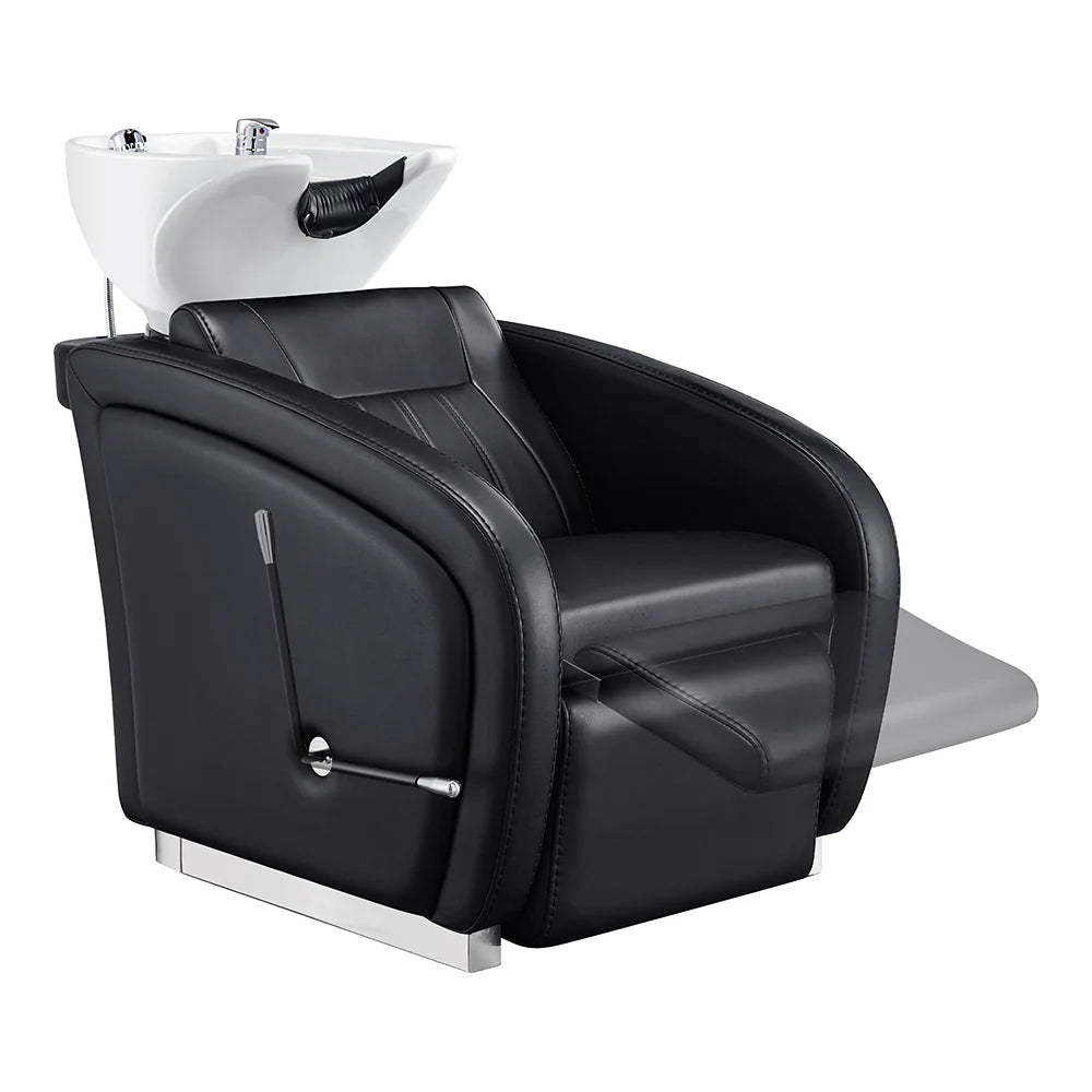 Black salon chair with white shampoo bowl on a white background