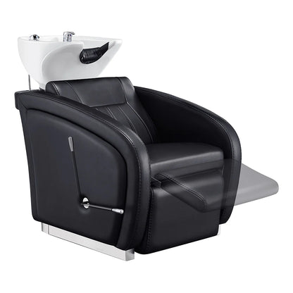 Black salon chair with white shampoo bowl on a white background
