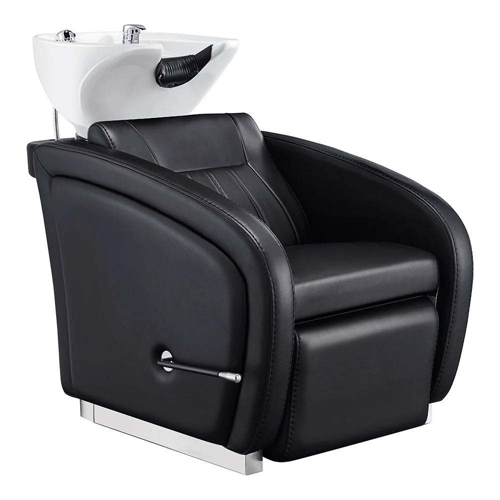 Black salon chair with white basin for hair washing on a white background