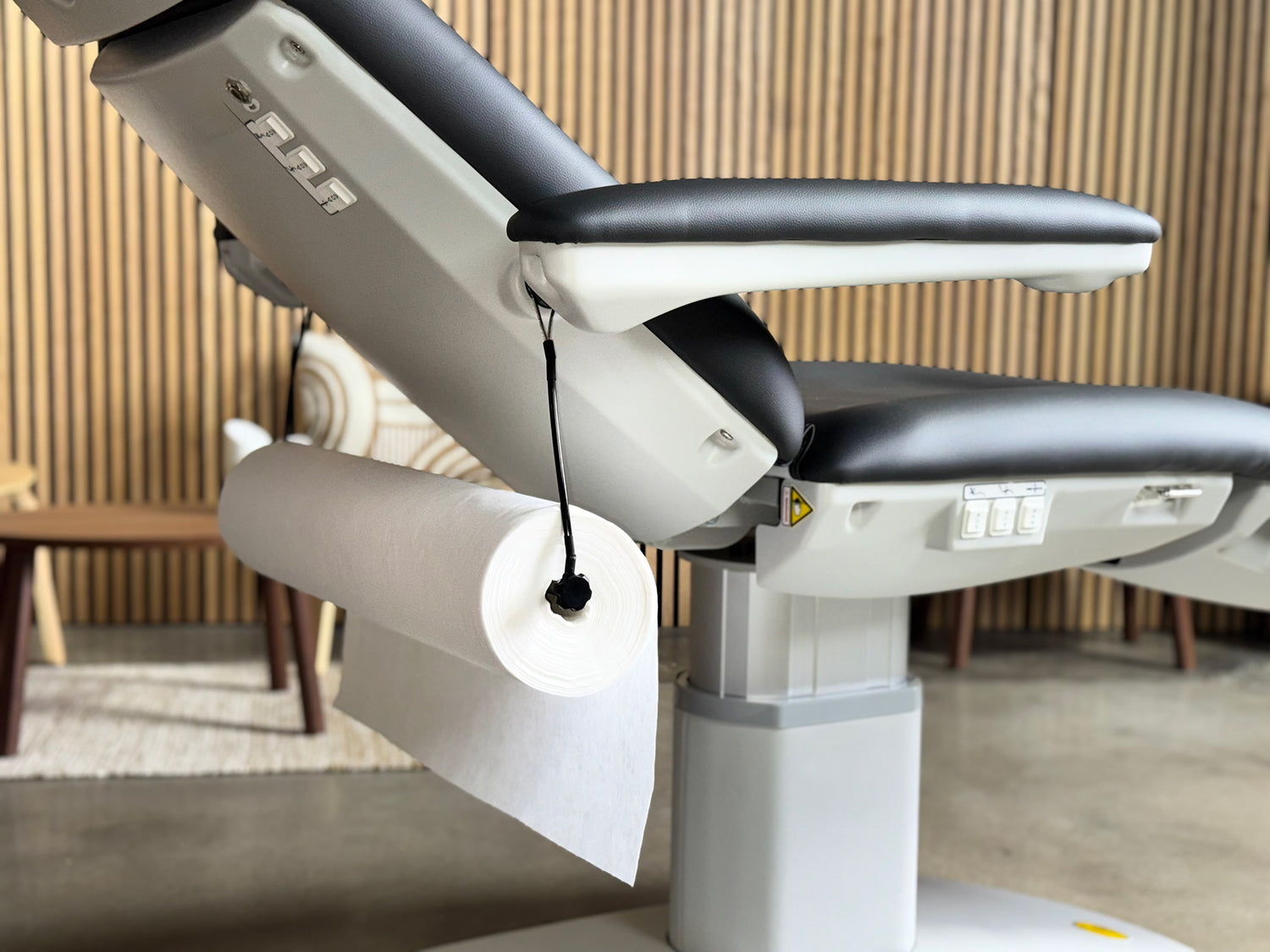spa bed cover roll installed on holder massage table setup