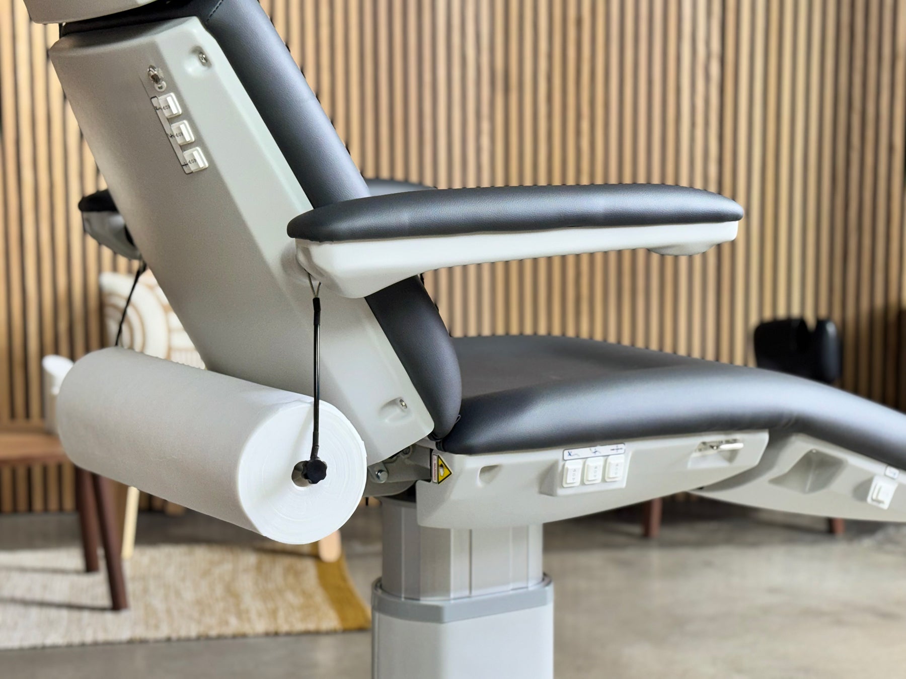 disposable bed cover roll holder under treatment chair spa exam table setup