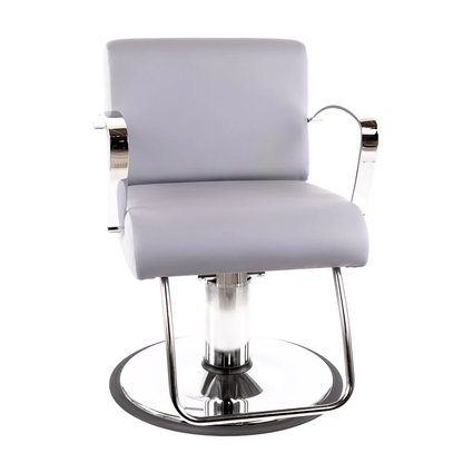 A hydraulic styling chair with chrome arms and base, and gray upholstery.