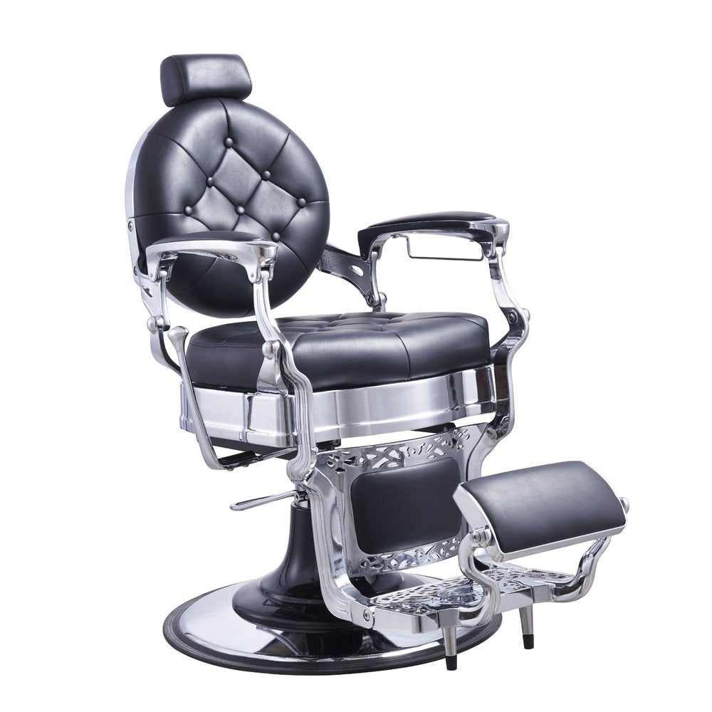 A black faux leather barber chair with a chrome frame, featuring a tufted backrest, armrests, a footrest, and a hydraulic pump.
