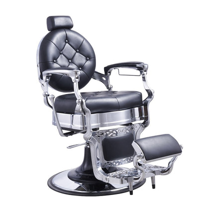A black faux leather barber chair with a chrome frame, featuring a tufted backrest, armrests, a footrest, and a hydraulic pump.