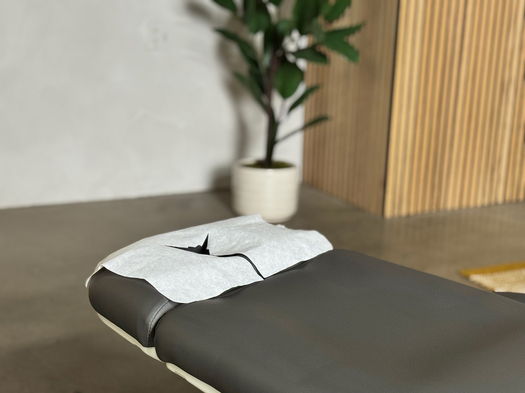 face cradle cover fitted securely on headrest spa massage table setup