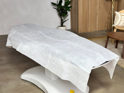 disposable bed sheet covering massage table full length professional spa setup