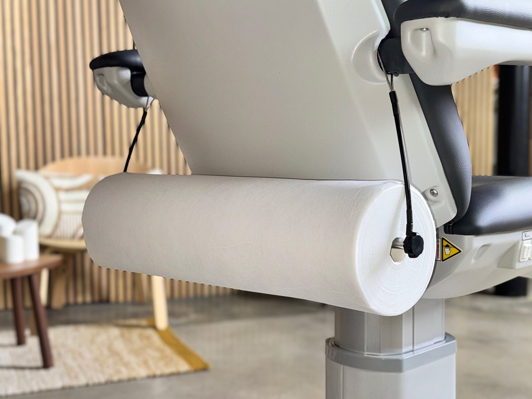 non woven bed sheet roll installed on holder close up disposable cover roll
