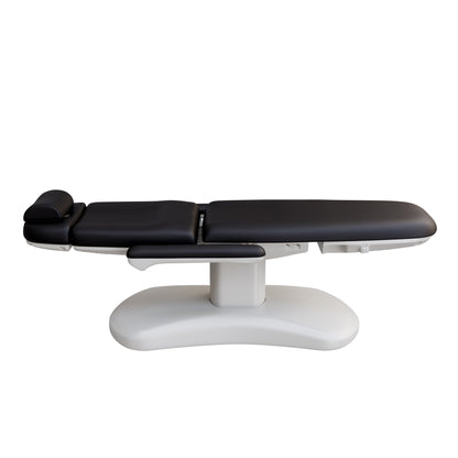 Spa Numa LUCENT 4 motor electric treatment chair with pedestal column base, vegan leather upholstery, Trendelenburg position, and adjustable armrests—ideal for facials, medspa services, and luxury salon treatments in compact spaces.