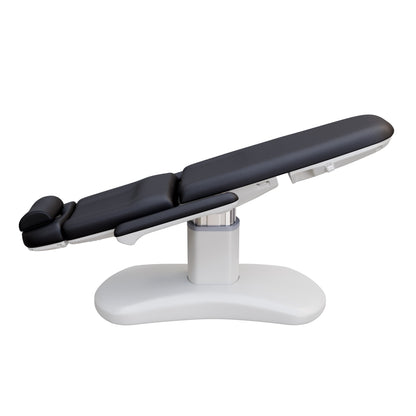 Spa Numa LUCENT 4 motor electric treatment chair with pedestal column base, vegan leather upholstery, Trendelenburg position, and adjustable armrests—ideal for facials, medspa services, and luxury salon treatments in compact spaces.