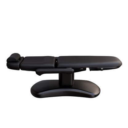 Spa Numa LUCENT 4 motor electric treatment chair with black pedestal base, vegan leather upholstery, Trendelenburg position, and adjustable armrests—perfect for luxury spas, facial treatments, and compact medspa rooms.