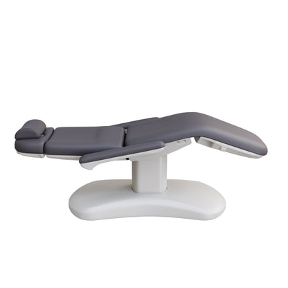 Spa Numa LUCENT 4 motor luxury electric treatment chair with pedestal base, Trendelenburg function, reversible armrests, and vegan leather upholstery—perfect for facials, medspa treatments, and compact spa rooms.