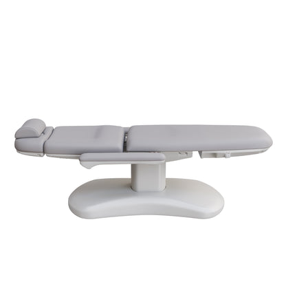 Spa Numa LUCENT 4 motor luxury electric treatment chair with pedestal base, Trendelenburg positioning, extendable headrest, and vegan leather upholstery—ideal for high-end spa, facial, and medical aesthetic procedures in compact treatment rooms.