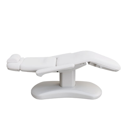 Spa Numa LUCENT 4 motor luxury electric treatment chair in vegan leather with pedestal base, reversible armrests, extendable headrest, and Trendelenburg position—ideal for high-end spa, salon, and aesthetic treatment procedures in compact spaces.