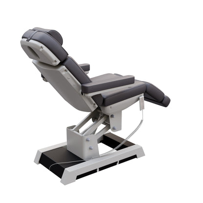 Spa Numa MILANO 4 motor medical-grade electric pedestal chair with built-in foot pedals – adjustable height, backrest, footrest, and tilt with removable armrests, vinyl upholstery, and reset function for clinical, spa, and wellness treatments.