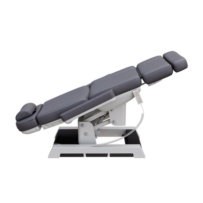 Spa Numa MILANO 4 motor medical-grade electric pedestal chair with built-in foot pedals – adjustable height, backrest, footrest, and tilt with removable armrests, vinyl upholstery, and reset function for clinical, spa, and wellness treatments.