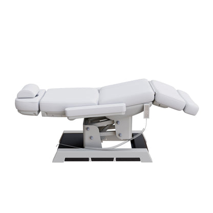 Spa Numa MILANO medical grade 4 motor electric pedestal chair with built-in foot controls – adjustable height, backrest, footrest, and tilt – removable armrests and face hole for spa, medical, and aesthetic treatments.