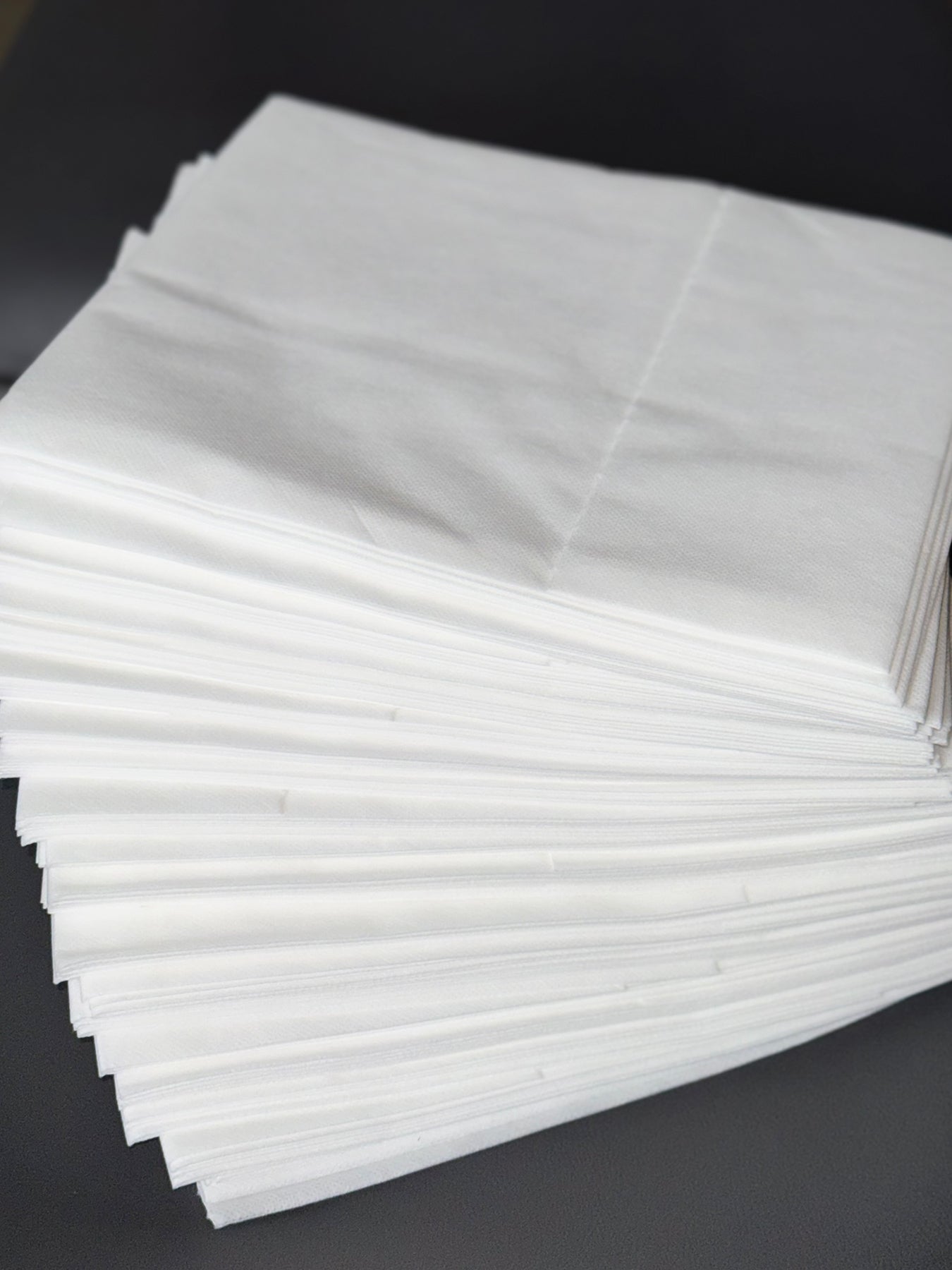 pre cut disposable bed sheets folded stack non woven spa supplies ready to use