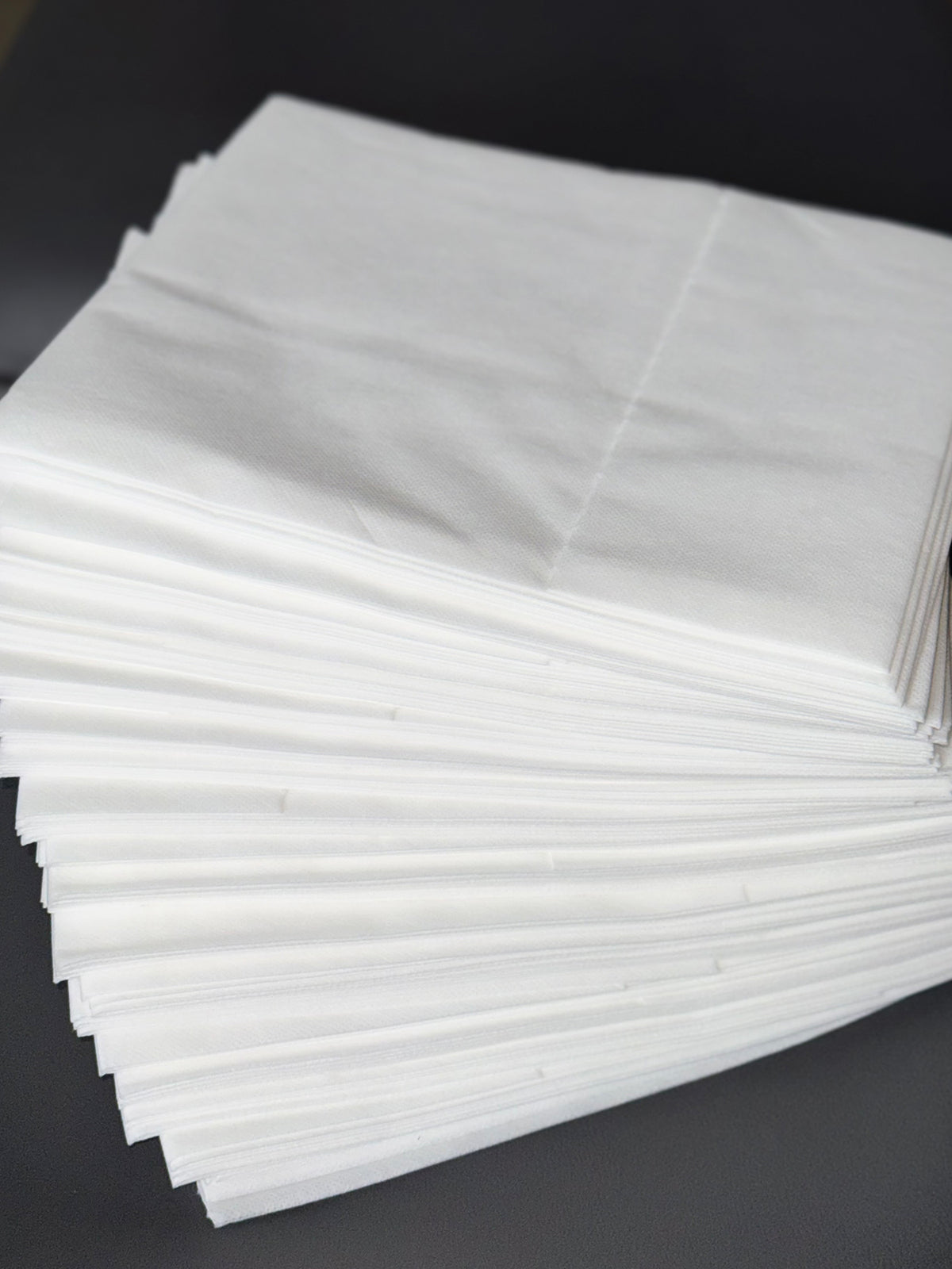 pre cut disposable bed sheets folded stack non woven spa supplies ready to use