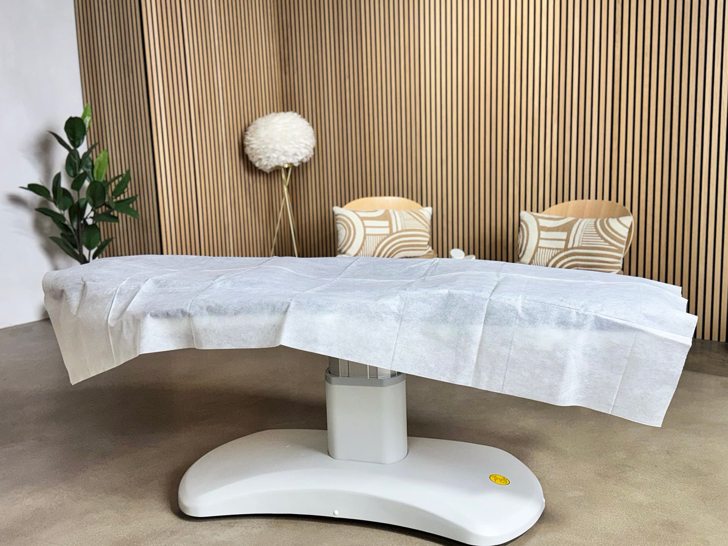 treatment table disposable sheet professional spa environment modern clinic setup