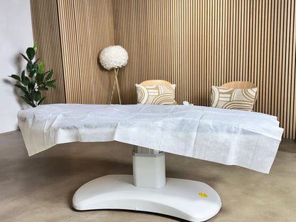 treatment table disposable sheet professional spa environment modern clinic setup