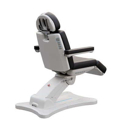 Spa Numa SERENITY 4 motor electric treatment chair in medical black vegan leather with 240-degree rotation, ADA-compliant 20-inch seat height, adjustable headrest, removable armrests, and LED-lit controls—ideal for aesthetic procedures, post-op evaluations, and outpatient treatments.