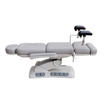 SPA NUMA OB-GYN Swivel Deluxe 4 motor electric treatment chair with stirrups, vegan leather upholstery, 120-degree rotation, for gynecological exams and aesthetic procedures.