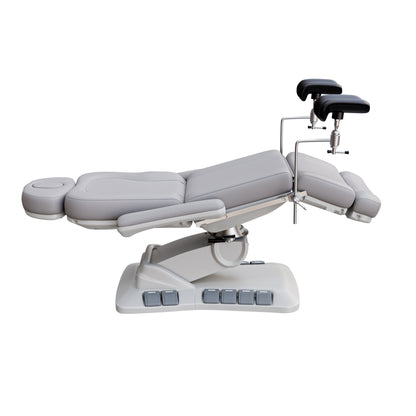 SPA NUMA OB-GYN Swivel Deluxe 4 motor electric treatment chair with stirrups, vegan leather upholstery, 120-degree rotation, for gynecological exams and aesthetic procedures.