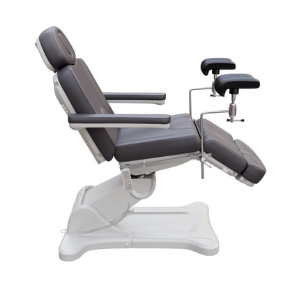 Spa Numa fully electric OB-GYN treatment chair with 240° swivel, surgical-grade stainless steel stirrups, adjustable backrest and leg rest, removable armrests, and PU leather upholstery for medical and esthetic use.