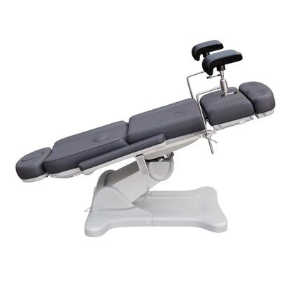 Spa Numa fully electric OB-GYN treatment chair with 240° swivel, surgical-grade stainless steel stirrups, adjustable backrest and leg rest, removable armrests, and PU leather upholstery for medical and esthetic use.