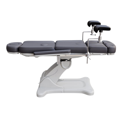 Spa Numa fully electric OB-GYN treatment chair with 240° swivel, surgical-grade stainless steel stirrups, adjustable backrest and leg rest, removable armrests, and PU leather upholstery for medical and esthetic use.