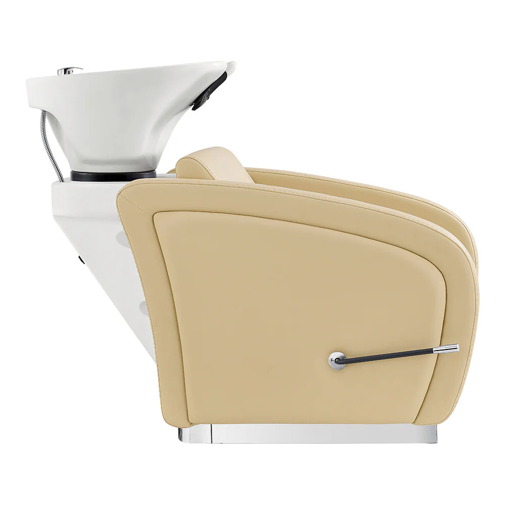 Beige salon chair with white basin and silver faucet on a white background