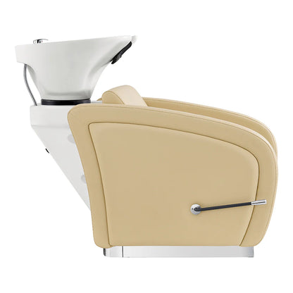Beige salon chair with white basin and silver faucet on a white background
