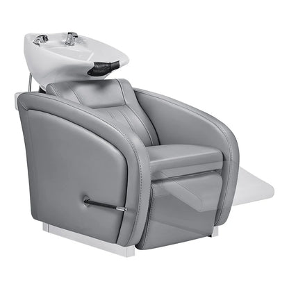Gray salon chair with a white basin on a white background