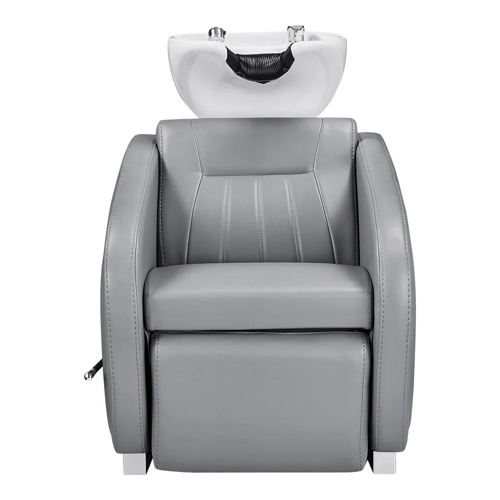 Gray salon chair with a white basin on a white background