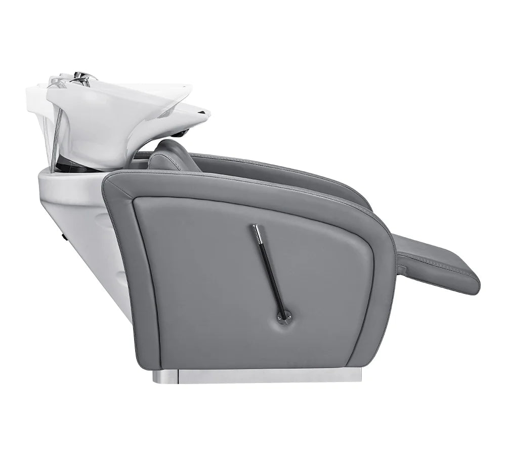 Gray salon chair with a white basin on a white background