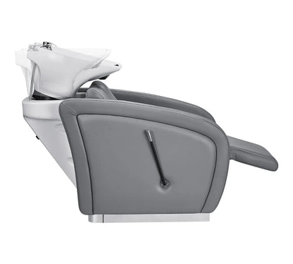Gray salon chair with a white basin on a white background