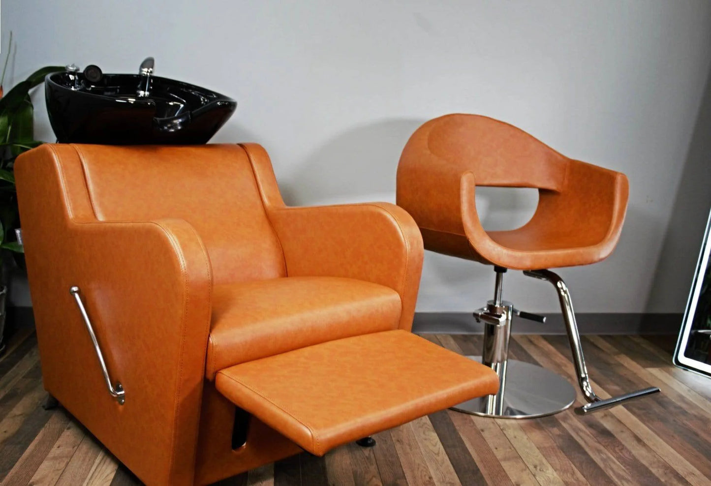 AYC Stanley Shampoo Unit featuring padded chair and ceramic sink for luxury salon experience