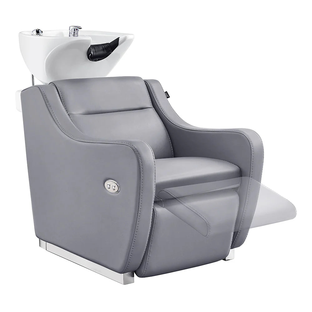 Gray salon chair with built-in shampoo bowl on a white background