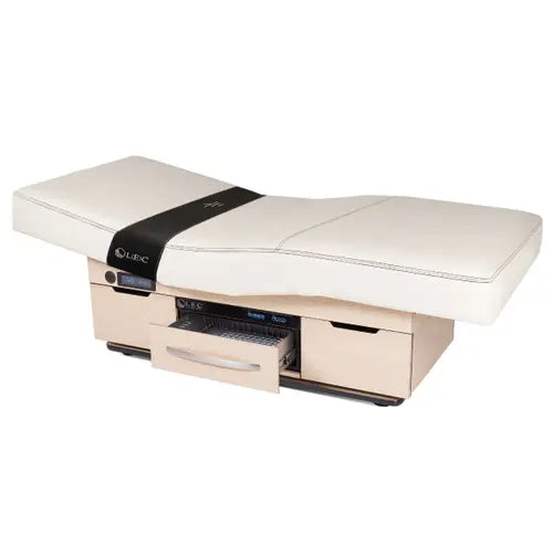 Professional spa and wellness table with dual pedestal support and warming drawer