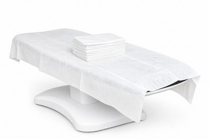 disposable flat bed sheet on spa treatment chair clean professional setup