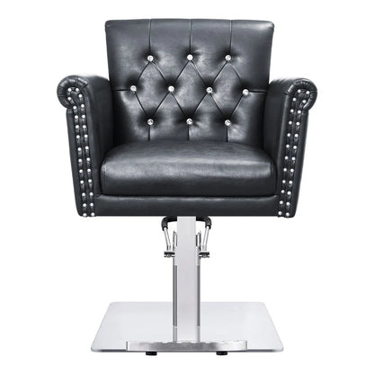 Black leather salon chair with studded details on a white background