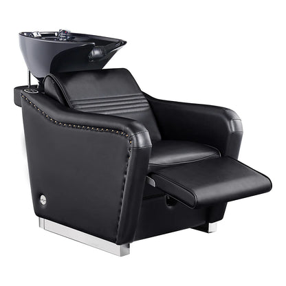 Black salon chair with built-in shampoo bowl on a white background