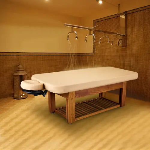 Ergonomic Napa La Mer spa bed featuring durable teak base for professional treatments