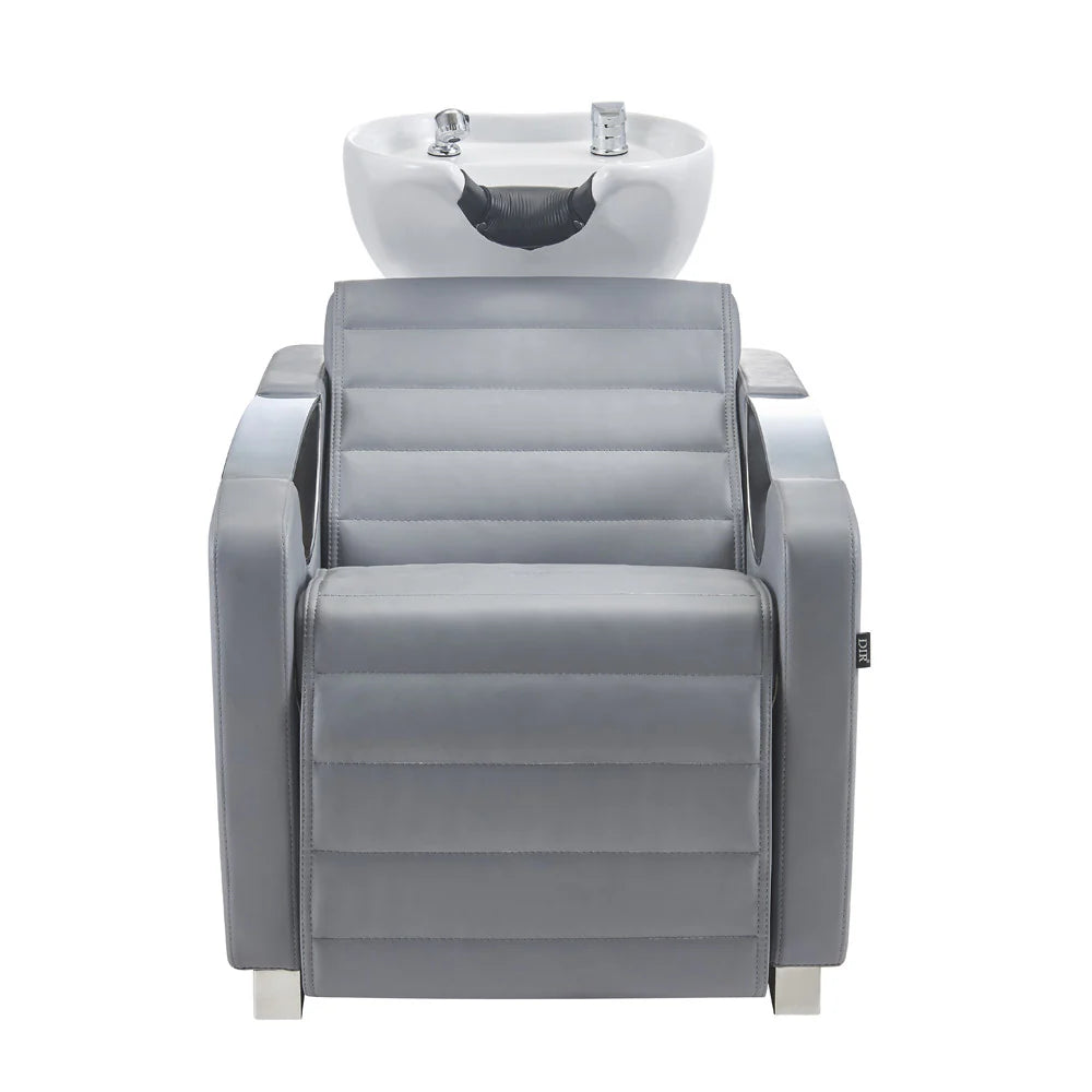 Gray salon chair with built-in sink on a white background