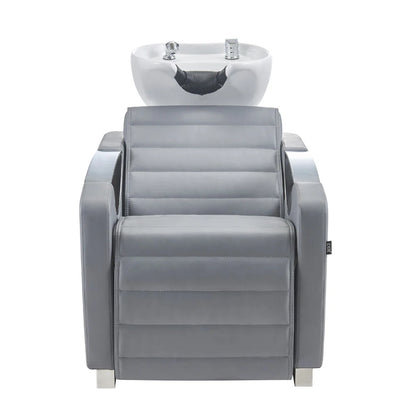 Gray salon chair with built-in sink on a white background