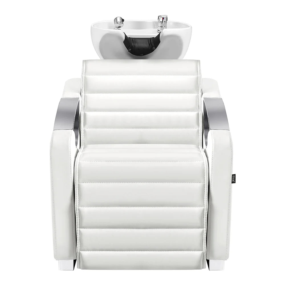 White salon chair with a sink above it on a white background