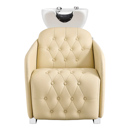 Beige salon chair with a white basin on a white background